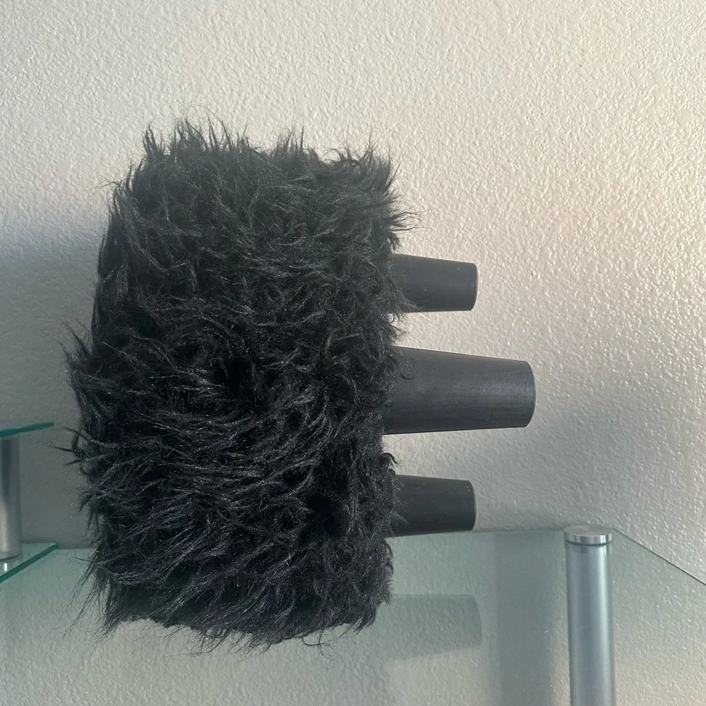 black faux fur ottoman/stool with 3 wooden legs
